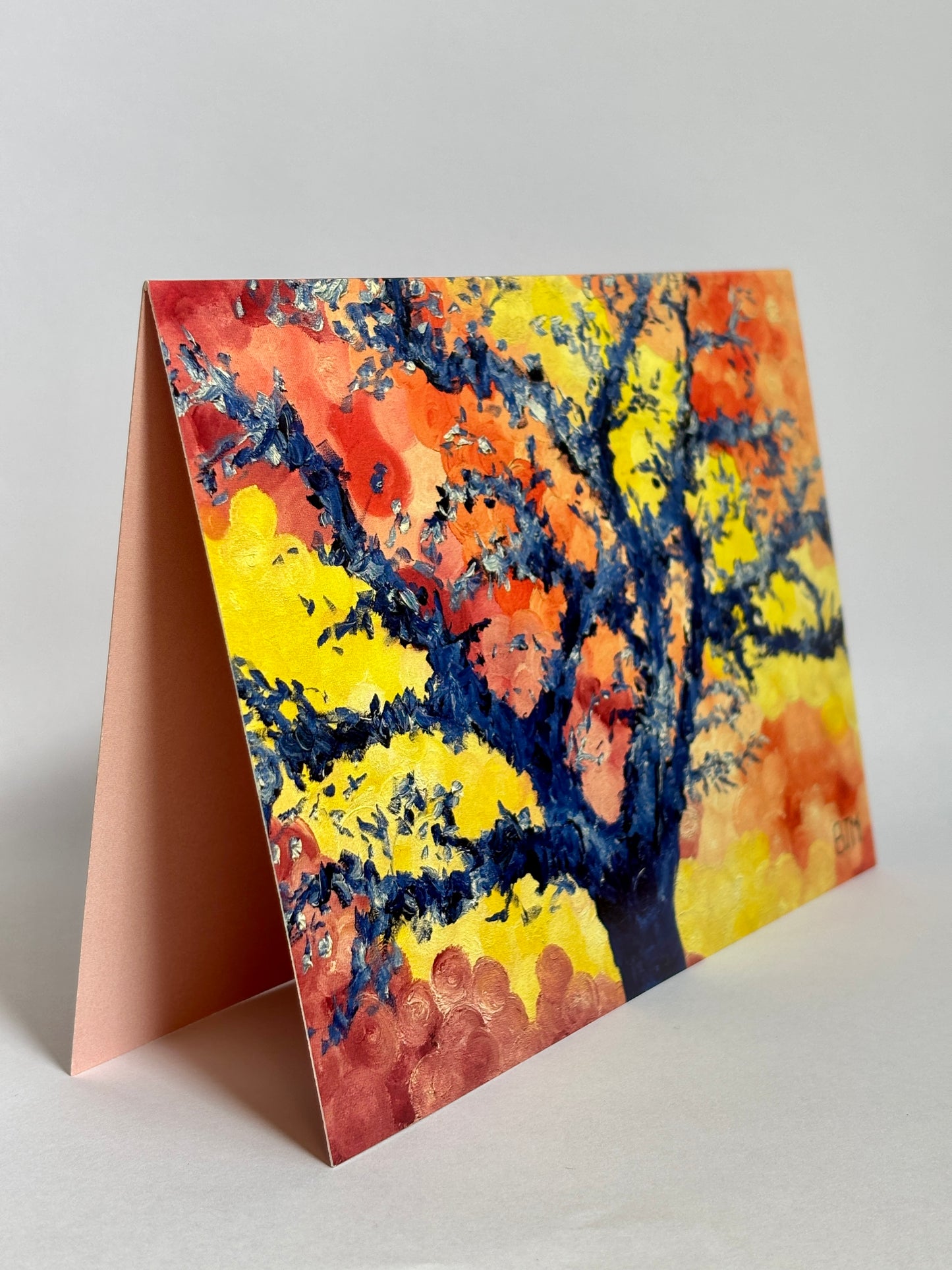 Colorful tree design on a greeting card with a plain background