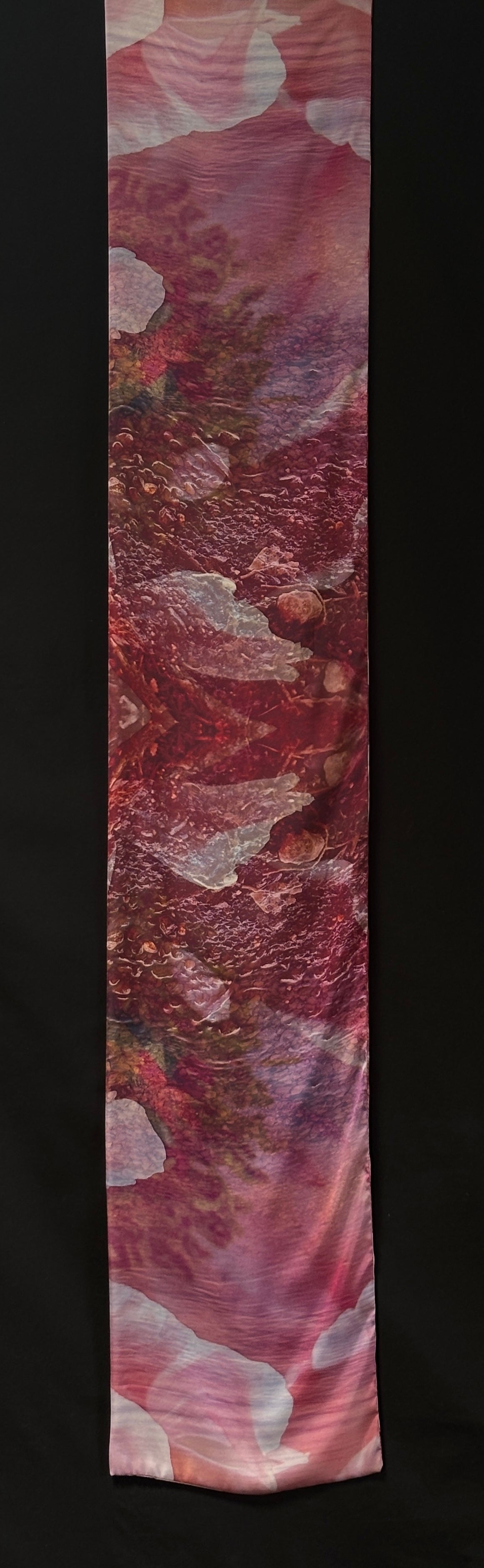 Front of scarf approximately 185cm x 33 cm. Pink petal shapes over pool of pebbles and ripples.