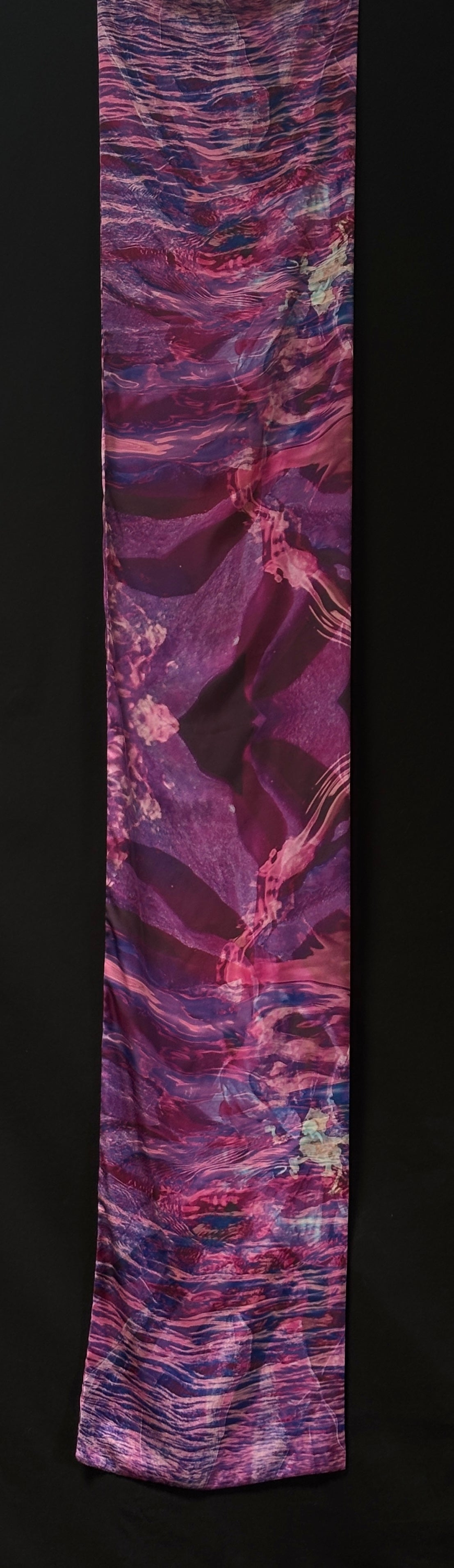 Back of scarf approximately 185cm x 33 cm. Abstract colours - pinks, purples, and blue. Can see ripples of water, and flower patterns.